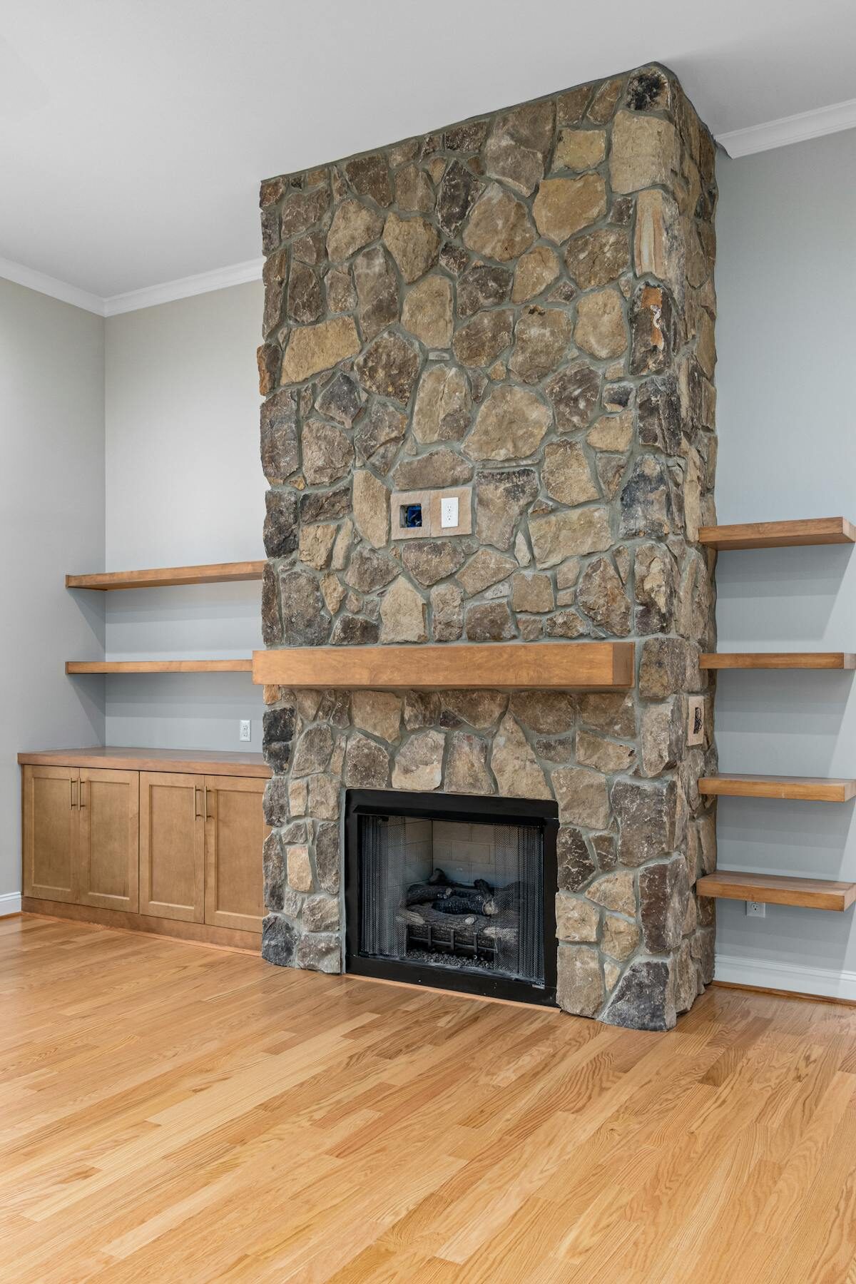 Custom fireplace surround and mantel — fluted pilasters and built-up shelf