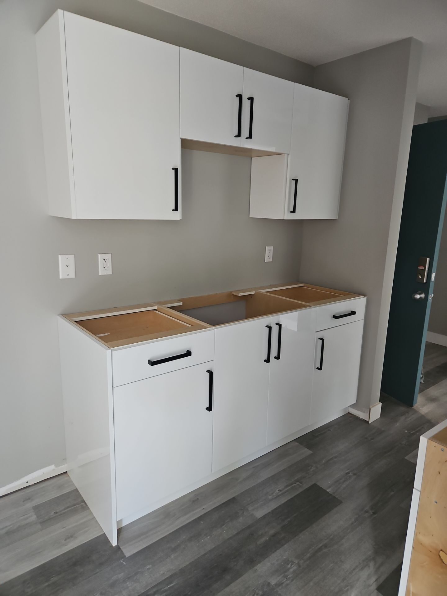 Rebuilt lower cabinets matched to existing uppers — Gore Ave, Chilliwack, BC