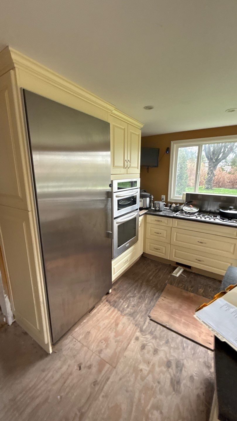 Rebuilt maple shaker cabinets with matched amber finish — Pitt Meadows, BC