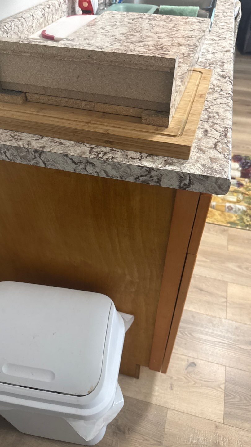 Rebuilt lower cabinet run with matched laminate finish — Shaw St, Mission, BC